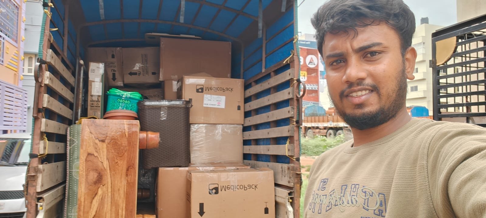 Lucky Packers moving truck with owner Vijay